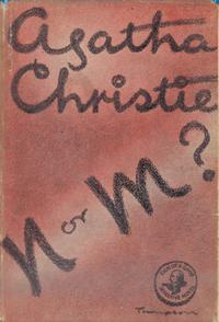 UK cover of N or M? brown/ maroon cover with big letters N or M? in black