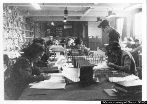 black and white photograph of women working at a desk at Bletchley Park